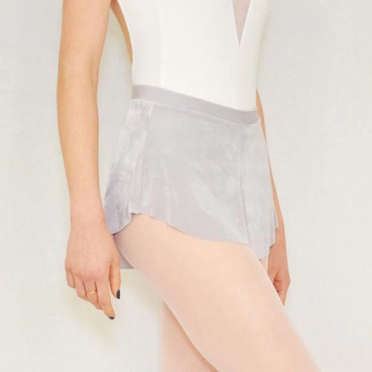 A ballerina wears a light silvery gray flowy Bullet Pointe ballet skirt. 