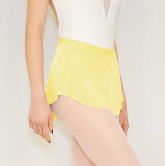 A ballerina wears a bright yellow flowy Bullet Pointe ballet skirt. 