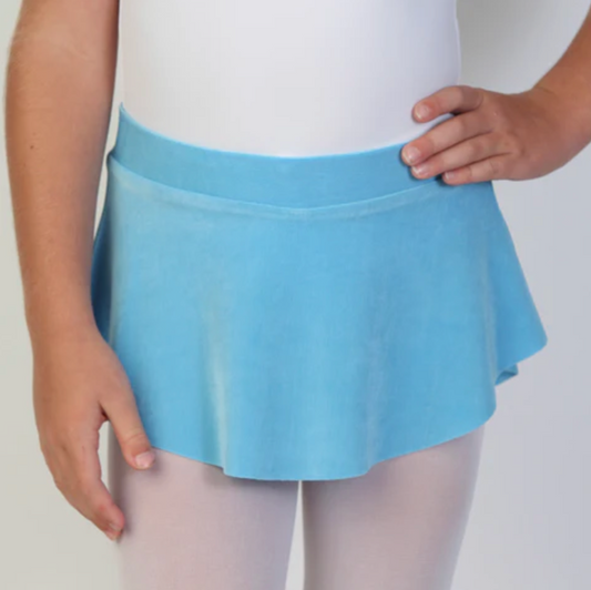 A young ballerina wears a bright blue flowy Bullet Pointe ballet skirt. 