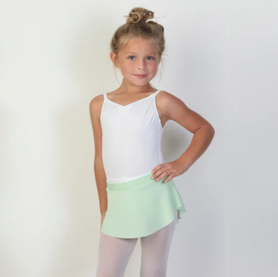 A young ballerina wears a bright seafoam green flowy Bullet Pointe ballet skirt. 